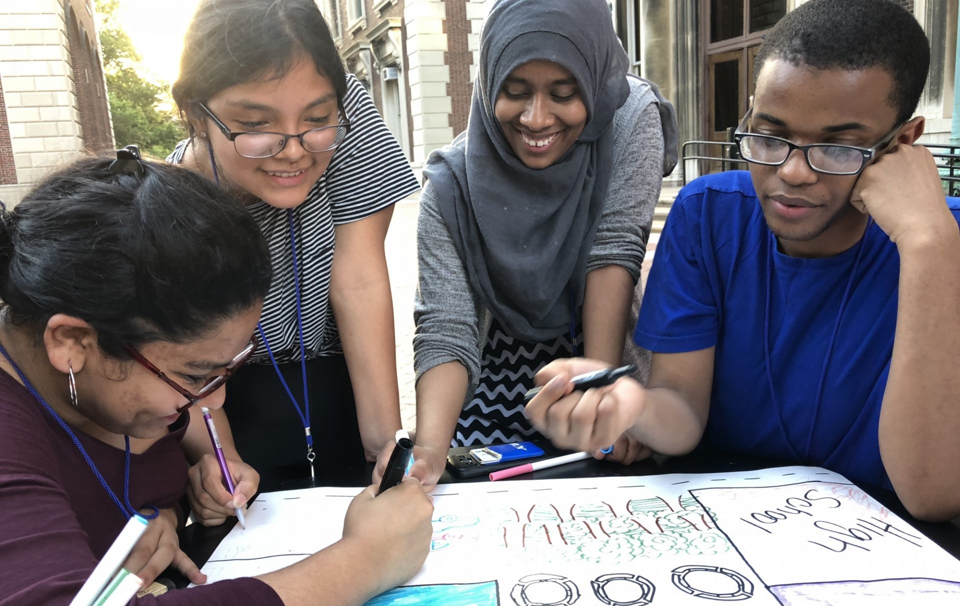 Students working on a poster