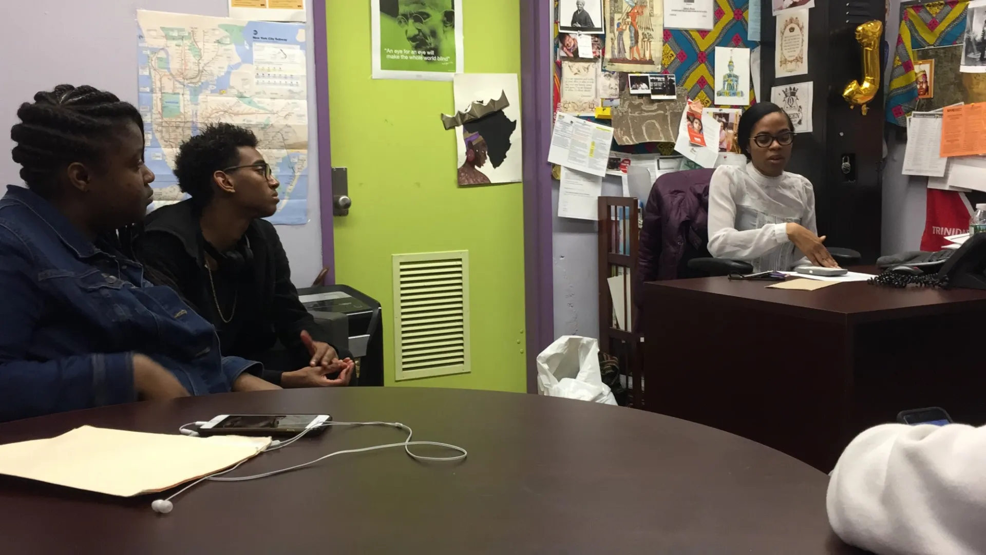 Students sitting, talking with Jamali Moses