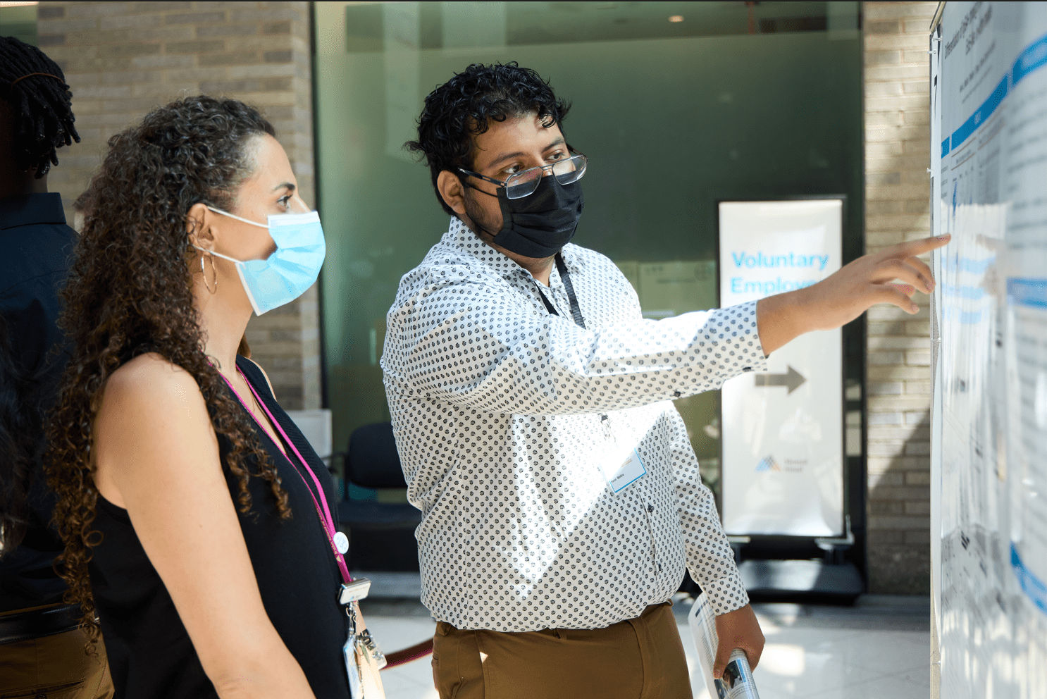 Kevin Medina presenting his research poster at the Icahn School of Medicine, where he was a summer intern in 2022. Kevin Medina pointing at his scientific research poster at the Icahn School of Medicine