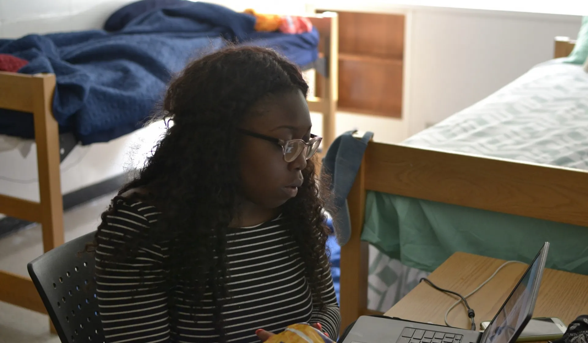 student working in the dorm