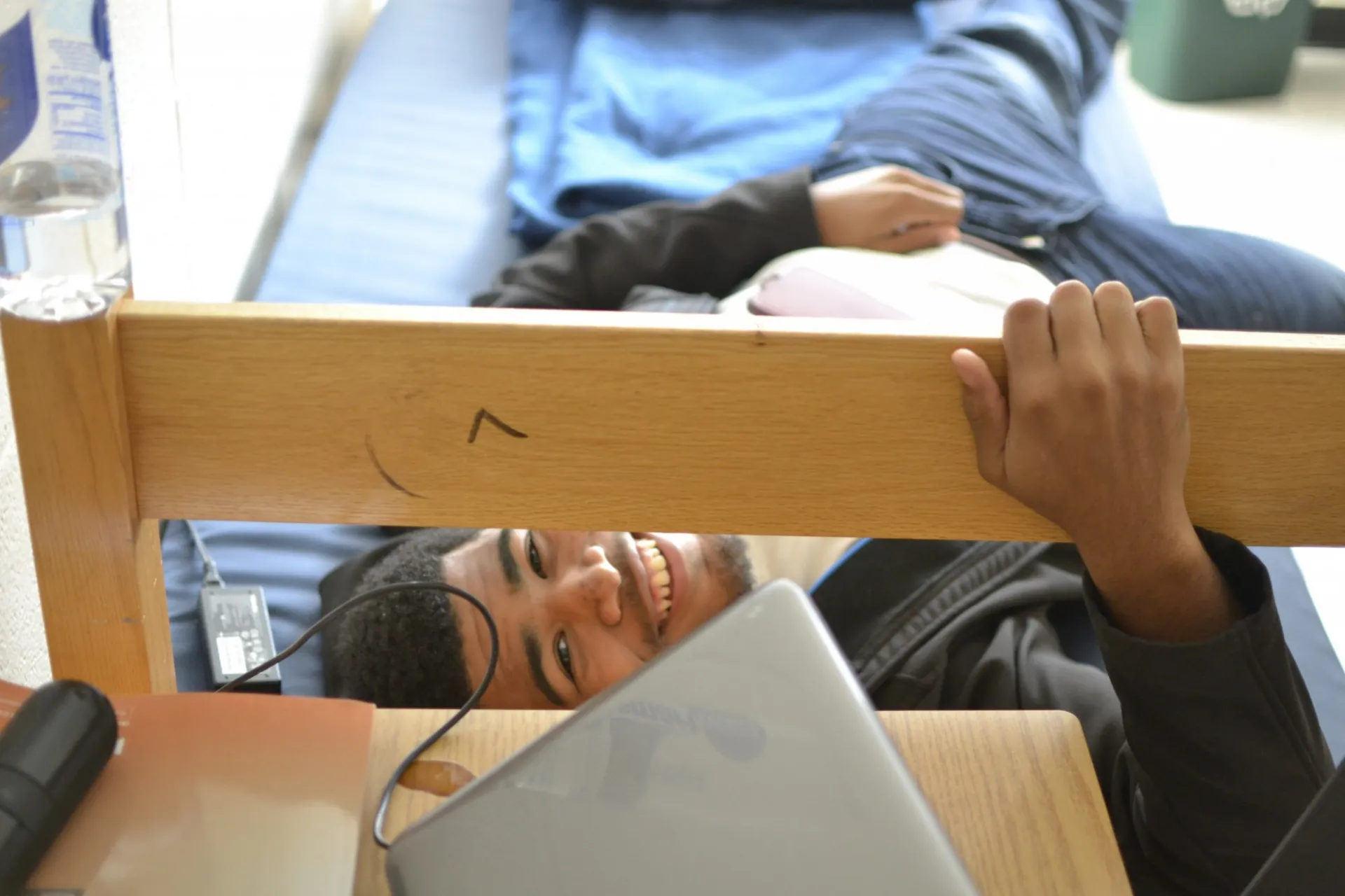 student lounging in dorm