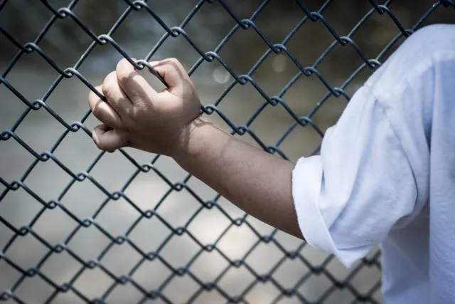 Pre- K student behind bars.